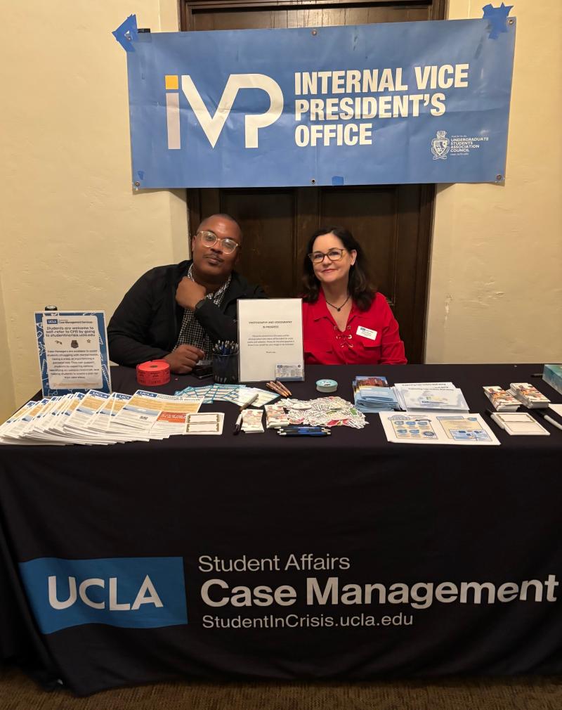 Photo of two Case Managers at the check-in table for the 2025 True Bruins R.A.I.S.E. Award Dinner Ceremony
