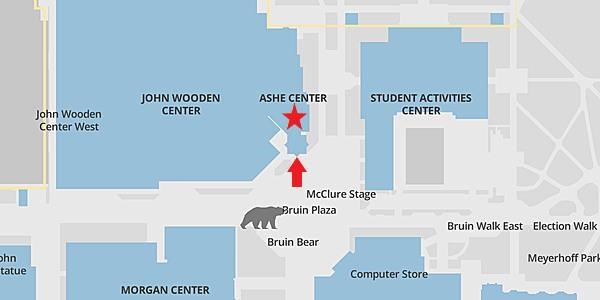 The image presents a map of UCLA's Bruin Walk with a red arrow pointing upwards towards Ashe Center and a red star below the text "Ashe Center."