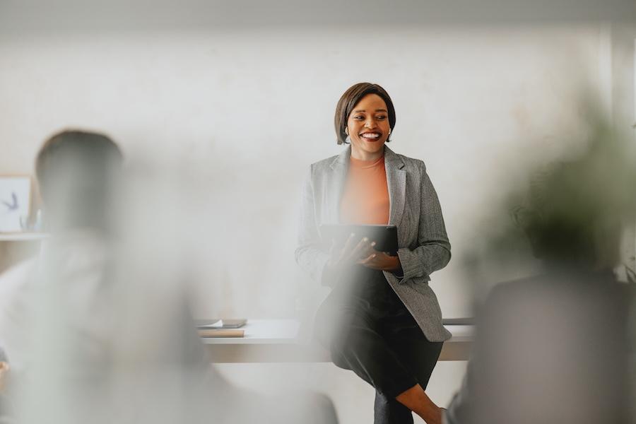 Businesswoman leading a group training in a modern office.